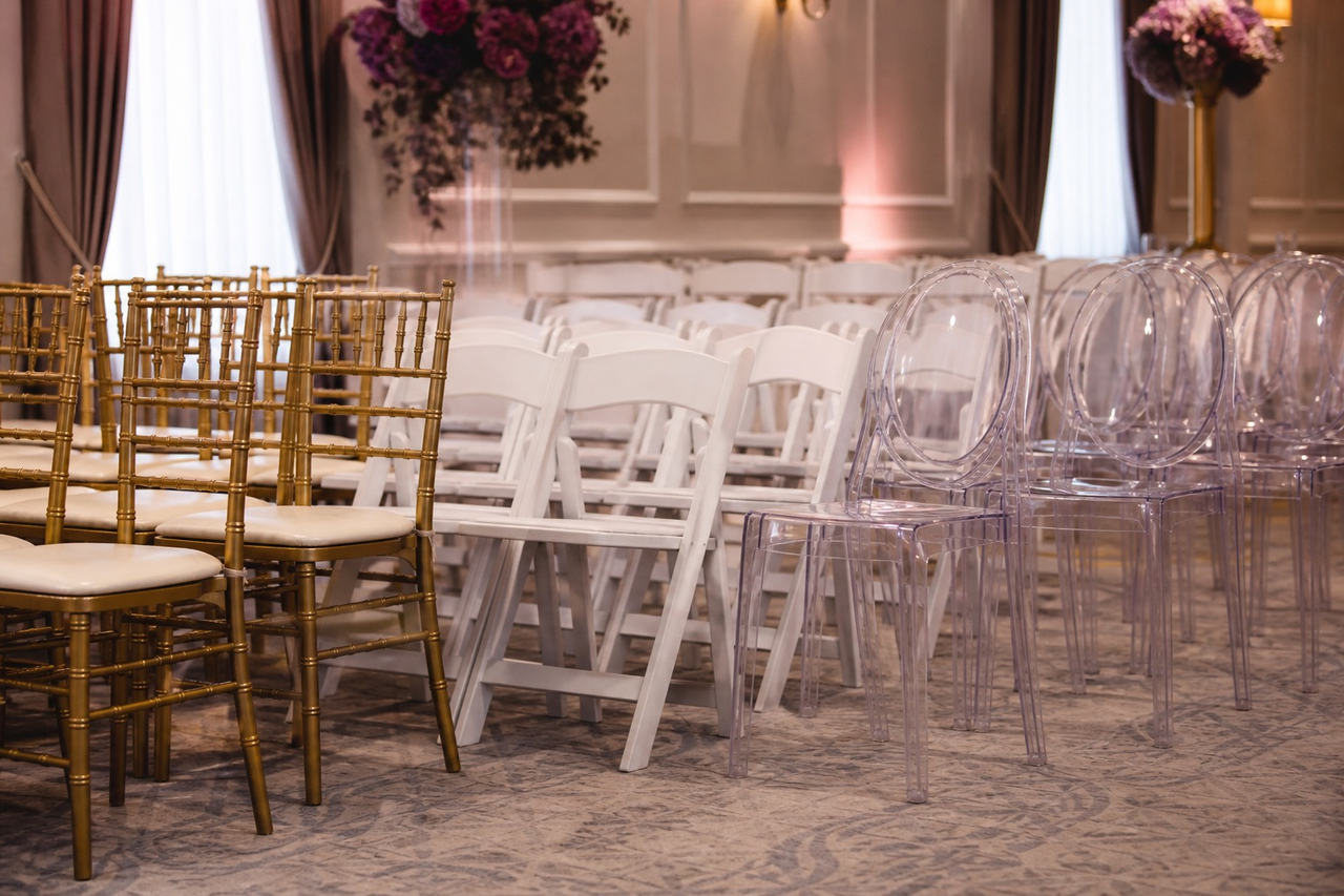 Gold, white, and clear event chairs for Greater Houston events
